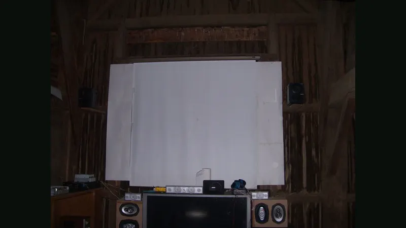 Home cinema projection screen in a barn theater
